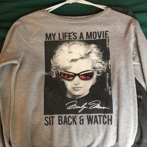 Silver sweater with writing